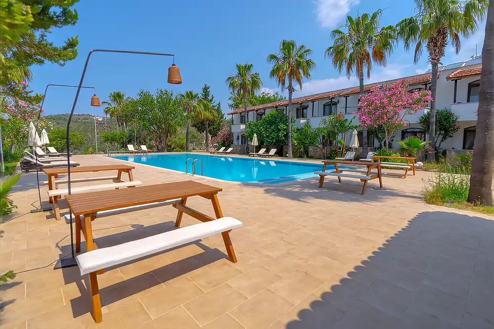 Xanthos Boutique Hotel — pool and landscaped garden on Palm Hill, Patara